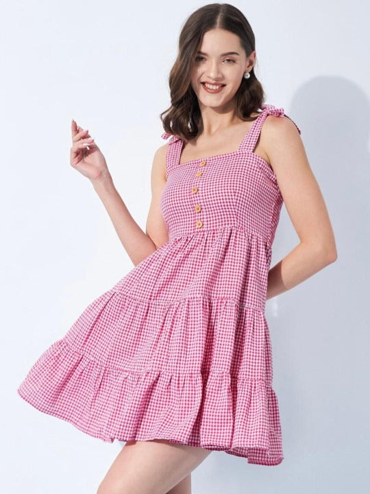 A light cotton dress with a flared shape and check pattern.