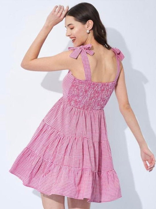 A light cotton dress with a flared shape and check pattern.